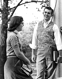 Image of Two students at flagpole ca1954
